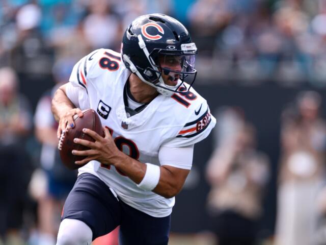 Chicago Bears quarterback Caleb Williams (18) looks to pass during the first half of an NFL football game, Sunday, Sept. 13, 2026, in Charlotte, N.C. (AP Photo/Scott Kinser)