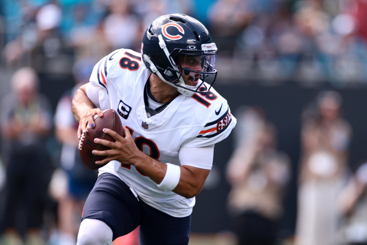 Chicago Bears quarterback Caleb Williams (18) looks to pass during the first half of an NFL football game, Sunday, Sept. 13, 2026, in Charlotte, N.C. (AP Photo/Scott Kinser)