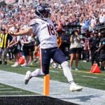 Chicago Bears quarterback Caleb Williams (18) runs to score a touchdown during the first half of an NFL football game, Sunday, Sept. 13, 2026, in Charlotte, N.C. (AP Photo/Scott Kinser)