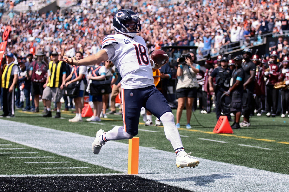 Chicago Bears quarterback Caleb Williams (18) runs to score a touchdown during the first half of an NFL football game, Sunday, Sept. 13, 2026, in Charlotte, N.C. (AP Photo/Scott Kinser)
