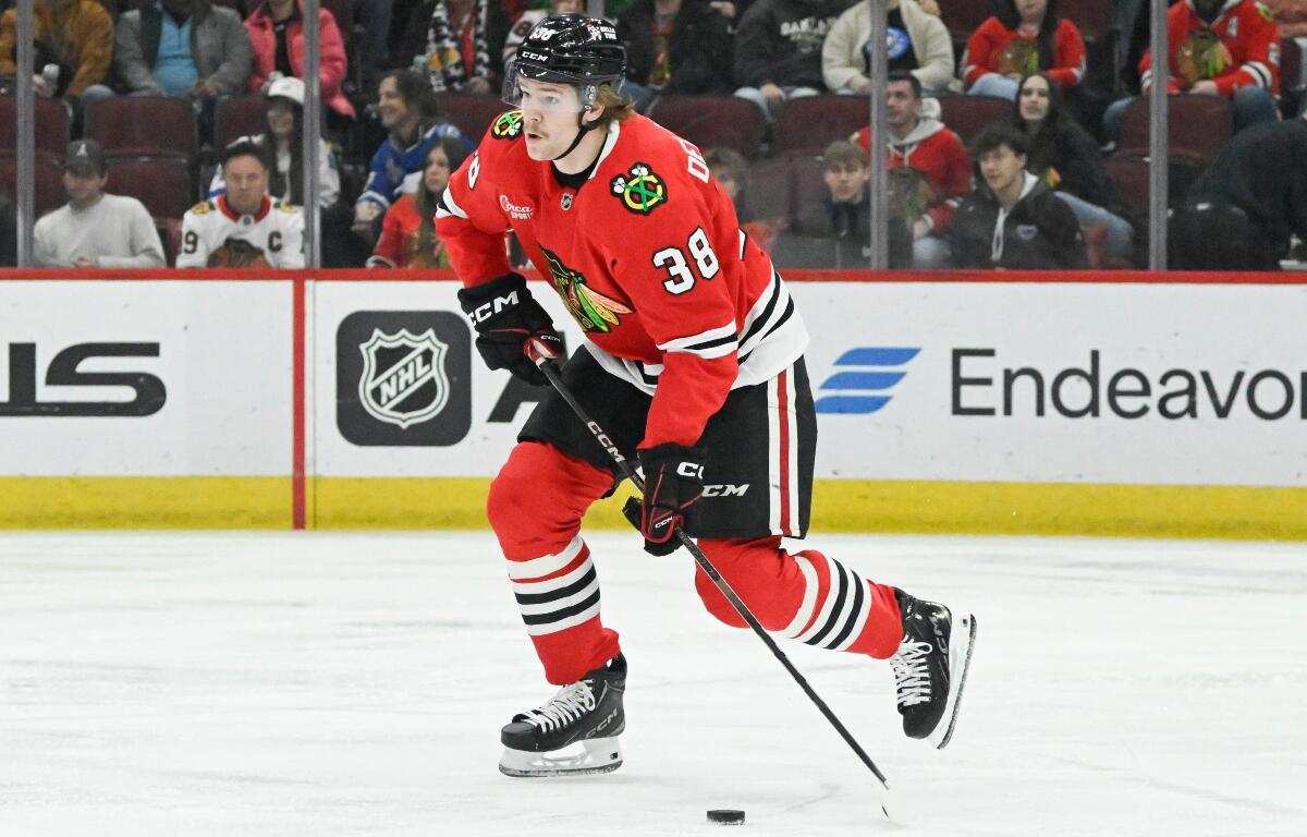 FILE - Chicago Blackhawks defenseman Ethan Del Mastro (38) skates with the puck during the first period of an NHL hockey game against the Tampa Bay Lightning, Jan. 24, 2025, in Chicago. (AP Photo/Matt Marton, File)