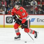 FILE - Chicago Blackhawks defenseman Ethan Del Mastro (38) skates with the puck during the first period of an NHL hockey game against the Tampa Bay Lightning, Jan. 24, 2025, in Chicago. (AP Photo/Matt Marton, File)