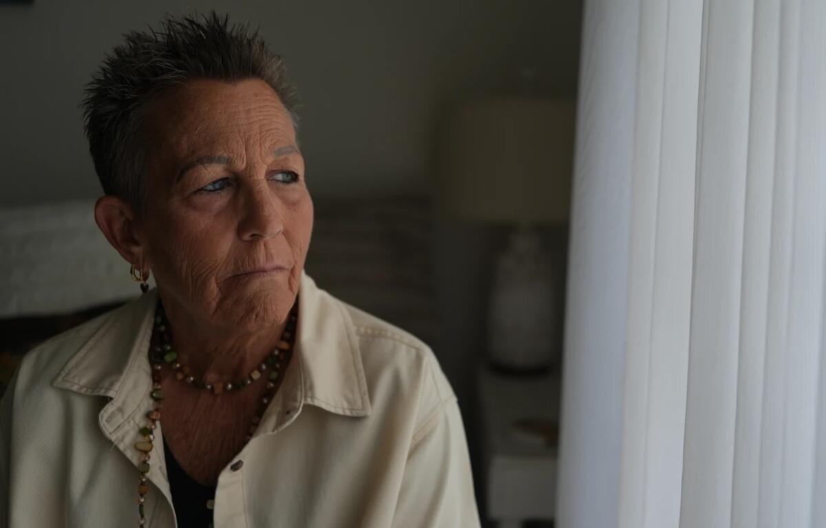 Deb Robertson, a leading advocate for a medical aid-in-dying law named after her in Illinois, pauses during an interview in her home in Lombard, Ill., on Tuesday, Sept. 8, 2026. (AP Photo/Luis Andres Henao)