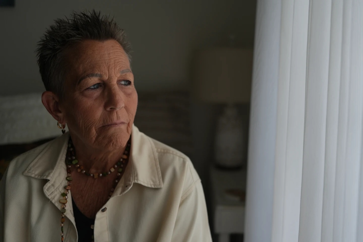 Deb Robertson, a leading advocate for a medical aid-in-dying law named after her in Illinois, pauses during an interview in her home in Lombard, Ill., on Tuesday, Sept. 8, 2026. (AP Photo/Luis Andres Henao)