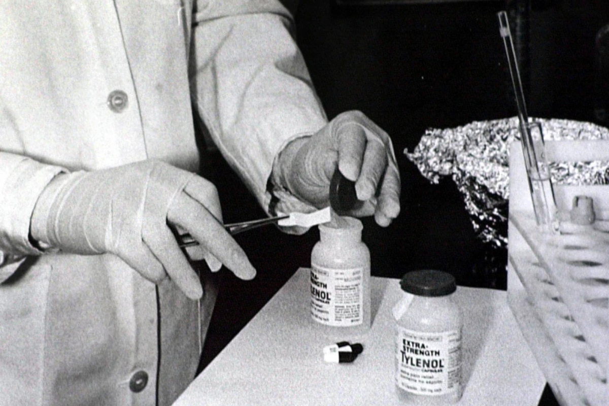 FILE - Bottles of Extra-Strength Tylenol are tested with a chemically treated paper that turns blue in the presence of cyanide at the Illinois Department of Health in Oct. 1982, in Chicago. (AP Photo/John Swart, File)