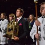 James Fulton Engstrom, center, his mother, Bonnie Engstrom, background center, and other family members present a relic of Archbishop Fulton Sheen during Sheen's beatification at the Dome at America's Center in St. Louis, on Thursday, Sept. 24, 2026. (AP Photo/Kate Munsch)