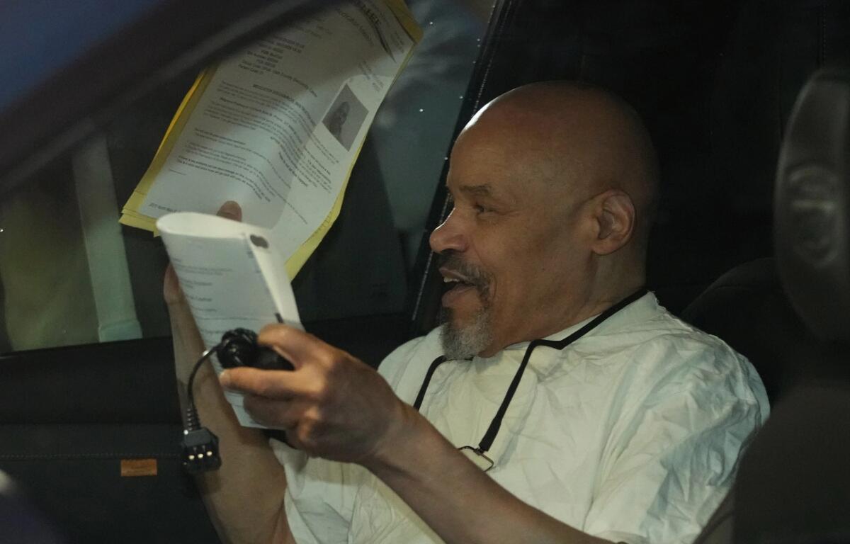 Douglas Stewart Carter sits in a car after he was released out of the Utah County Jail as a Utah judged ordered his release from jail on Monday Sept. 28, 2026, in Spanish Fork, Utah. (AP Photo/George Frey)