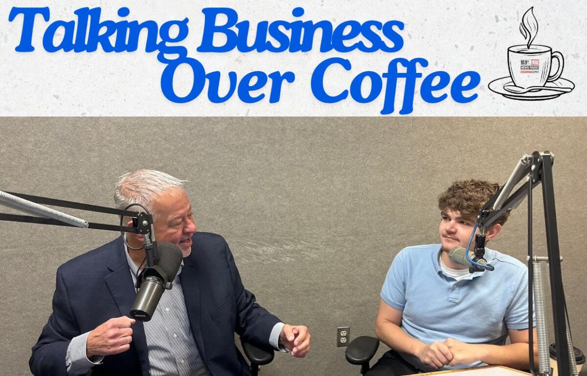 Capitol Media Group VP/GM Chris Bullock talks with Nick Tranquilli of Dust Busters in Springfield.