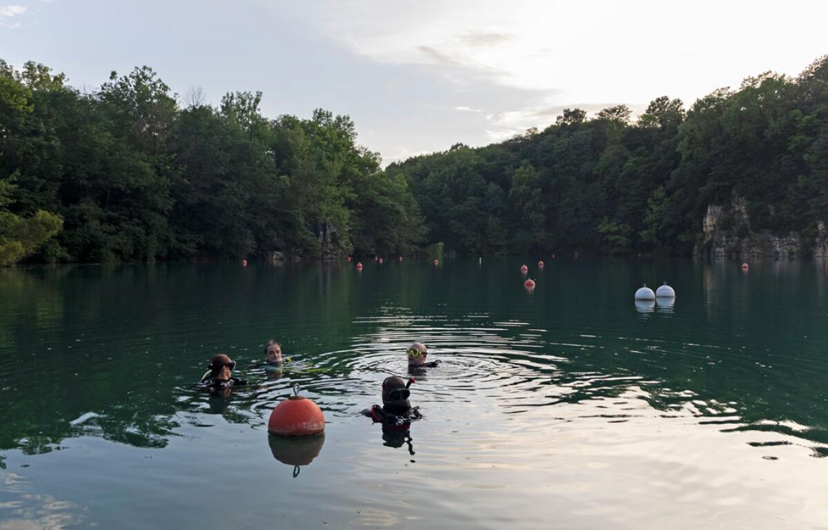 Divers from Great American Divers in St. Charles, Missouri, practice at Mermet Springs on July 17, 2026, in Belknap, Illinois. (Peyton Cook for the Saluki Local Reporting Lab)