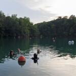 Divers from Great American Divers in St. Charles, Missouri, practice at Mermet Springs on July 17, 2026, in Belknap, Illinois. (Peyton Cook for the Saluki Local Reporting Lab)