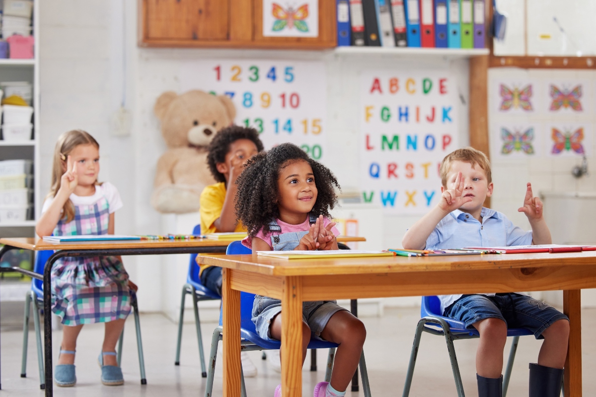 With preschool, your child gets a head start. Shot of a group of preschool students sitting in a classroom.