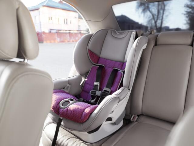 Empty modern child safety seat inside car.