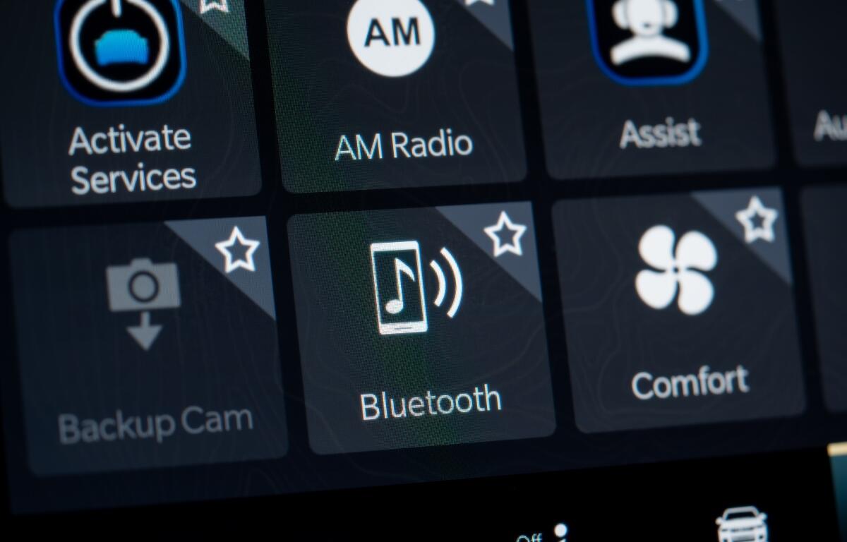 Close up of car infotainment screen with Bluetooth option. Toronto, Canada - February 19, 2026.