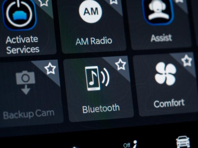 Close up of car infotainment screen with Bluetooth option. Toronto, Canada - February 19, 2026.