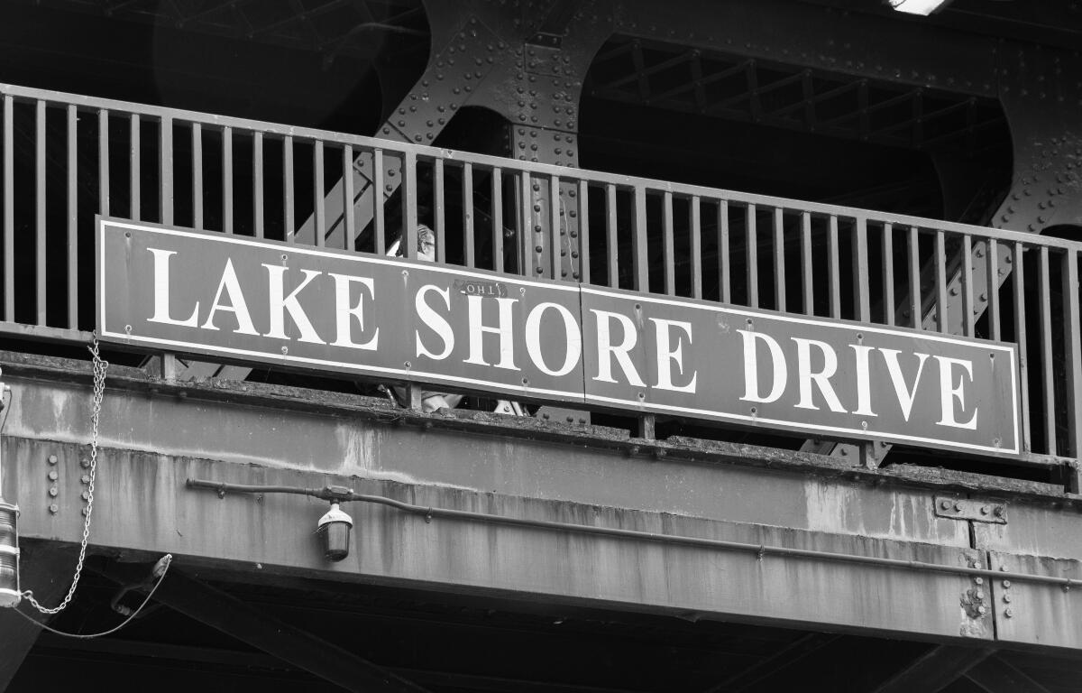 FILE - Big Lake Shore Drive sign on a Chicago bridge