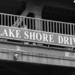 FILE - Big Lake Shore Drive sign on a Chicago bridge