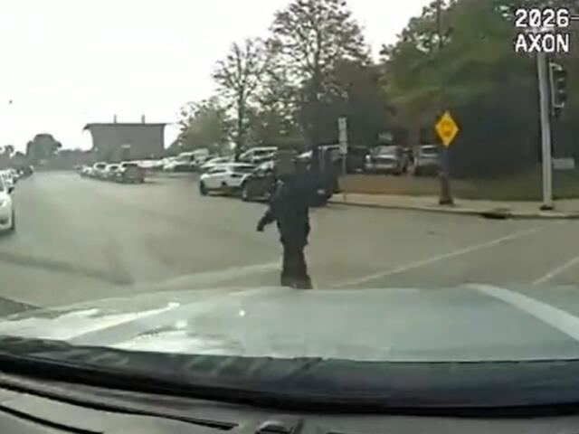 A screen shot of the dash camera video of Lt. Andrew Henton's squad car before it hit a pedestrian September 24, 2026.