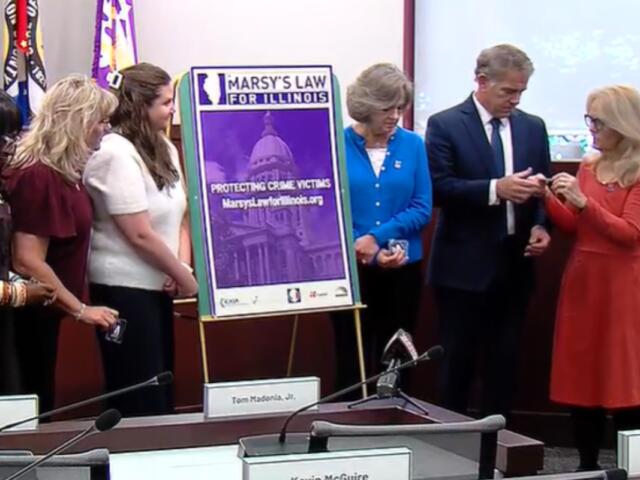Sangamon County State's Attorney John Milhiser and others take part in a ceremony from the advocates for "Marsy's Law."