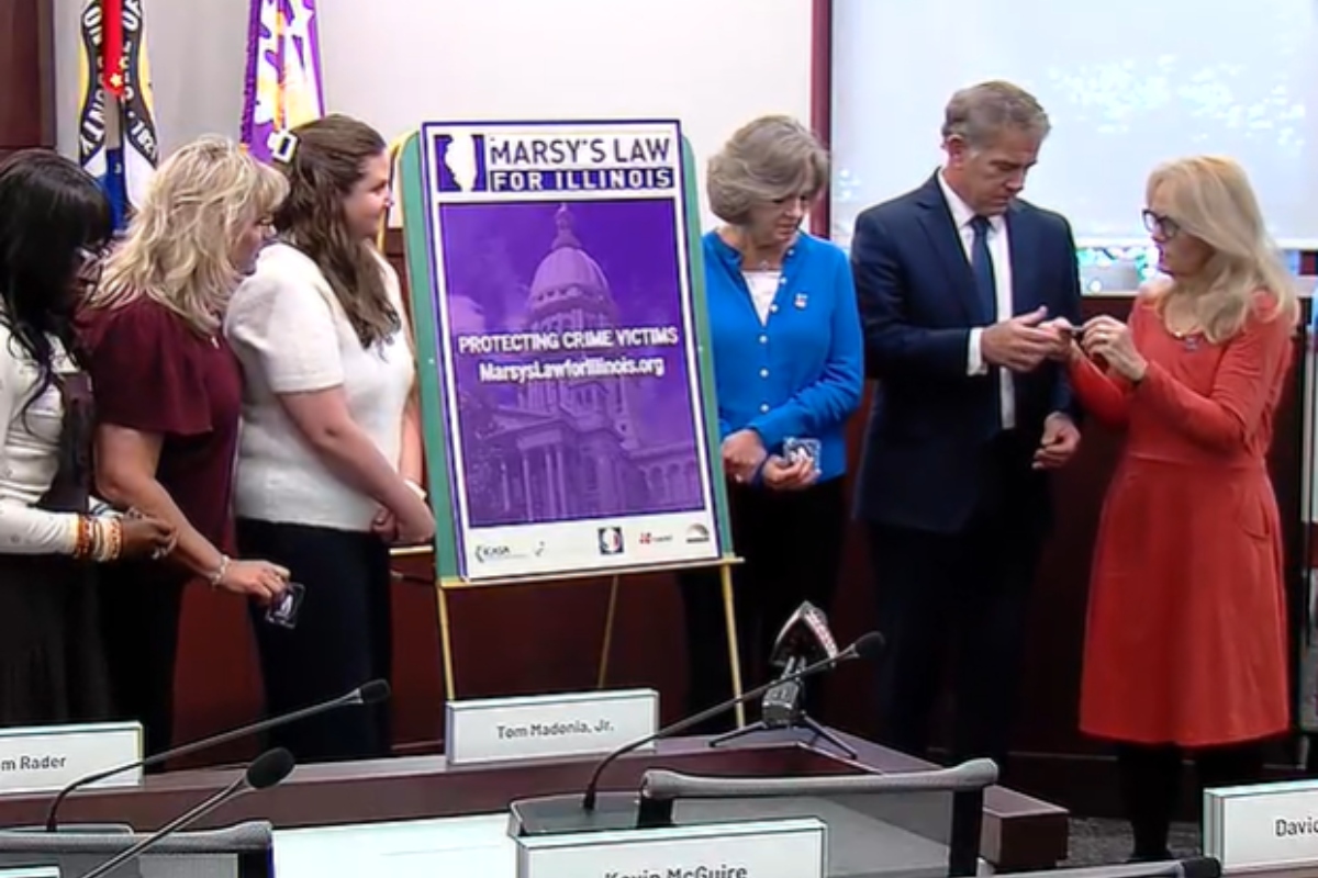 Sangamon County State's Attorney John Milhiser and others take part in a ceremony from the advocates for "Marsy's Law."