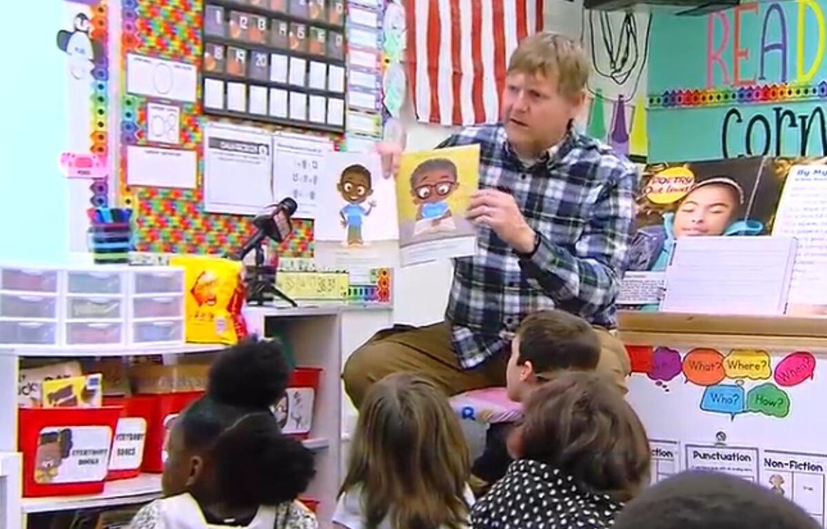 Shane Briggs reads to students at Southern View Elementary School in Springfield District 186.