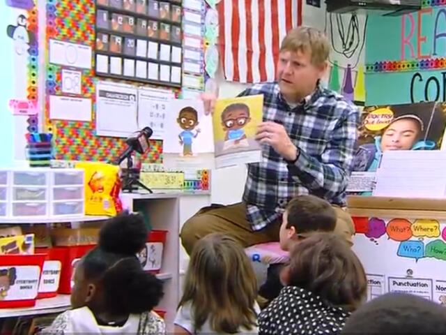 Shane Briggs reads to students at Southern View Elementary School in Springfield District 186.