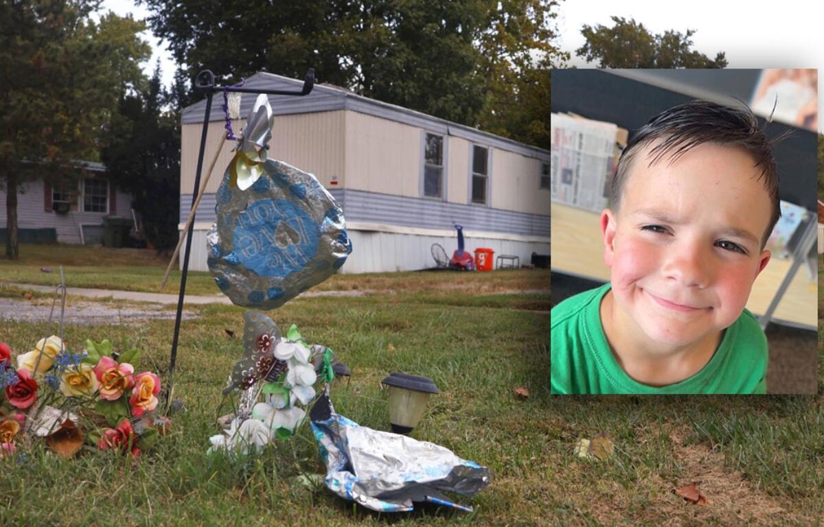 A memorial for 8-year-old Leland Arnett pictured in front of the trailer where the family lived on Hickory Street in DeSoto. (Photo by Brayden Guy, Daily Egyptian)