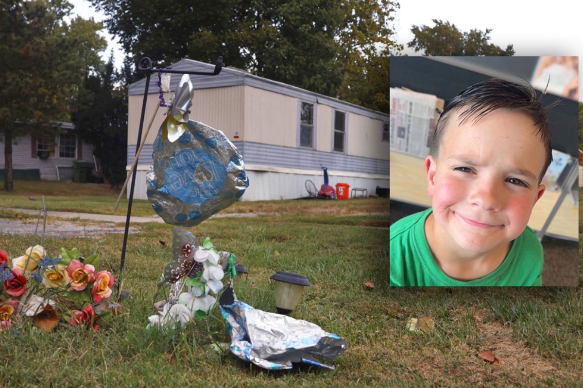 A memorial for 8-year-old Leland Arnett pictured in front of the trailer where the family lived on Hickory Street in DeSoto. (Photo by Brayden Guy, Daily Egyptian)
