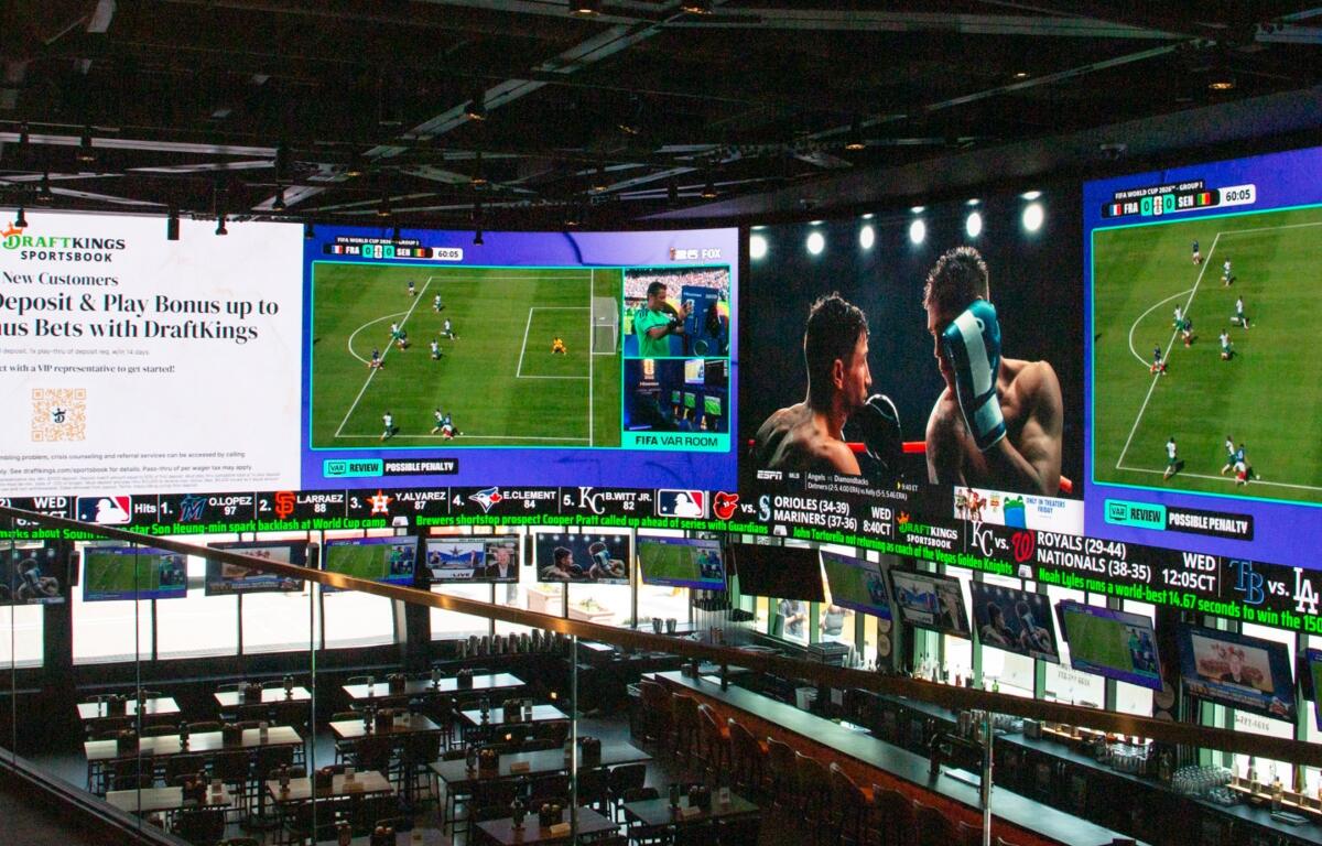 A massive 2,000-square-foot television wraps around the DraftKings Sports Bar at Wrigley Field. (Capitol News Illinois photo by Maggie Dougherty)