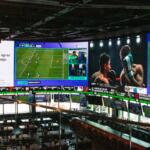 A massive 2,000-square-foot television wraps around the DraftKings Sports Bar at Wrigley Field. (Capitol News Illinois photo by Maggie Dougherty)