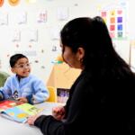 Joanna Isitt, 28, reads with her son, Xavier Rogers, 4, before teaching her Head Start class at Hometown Child Care on Wednesday, Sept. 23, 2026, in Aurora, Ill. (AP Photo/Octavio Jones)