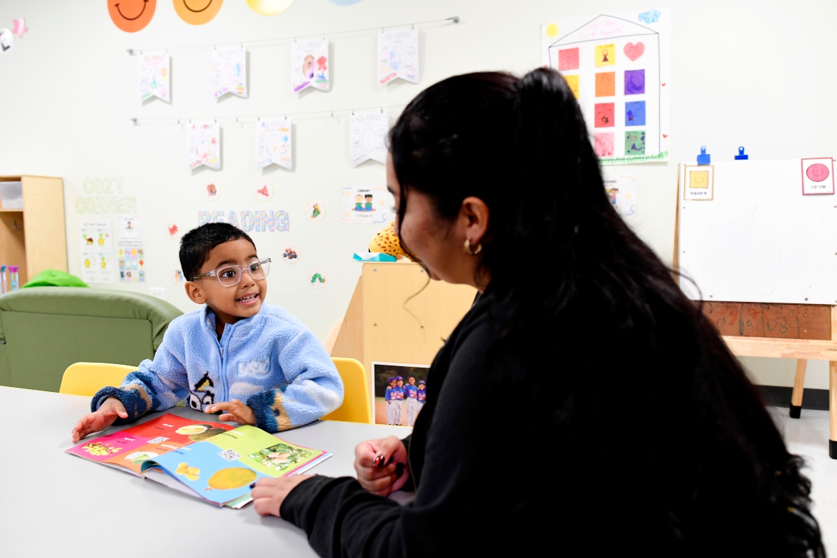 Joanna Isitt, 28, reads with her son, Xavier Rogers, 4, before teaching her Head Start class at Hometown Child Care on Wednesday, Sept. 23, 2026, in Aurora, Ill. (AP Photo/Octavio Jones)