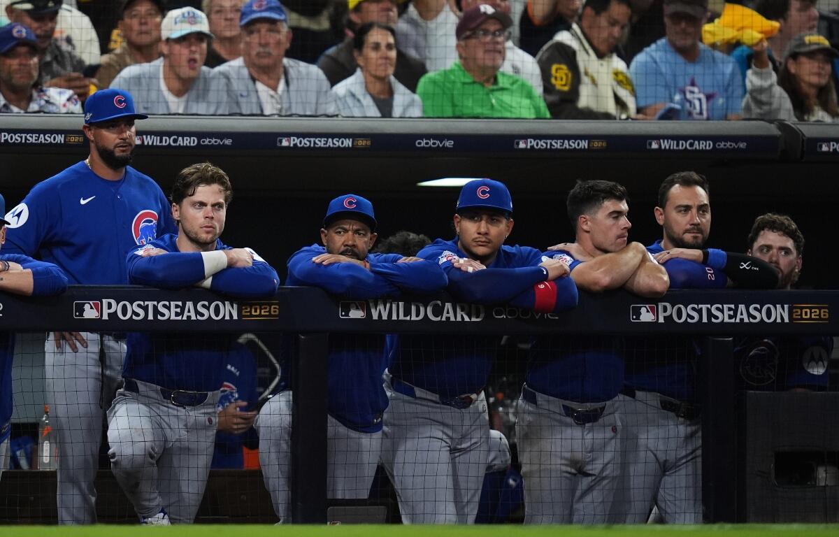 The Chicago Cubs dugout watches in the seventh inning against the San Diego Padres in Game 2 of the National League Wild Card baseball playoff series Wednesday, Sept. 30, 2026, in San Diego. (AP Photo/Gregory Bull)