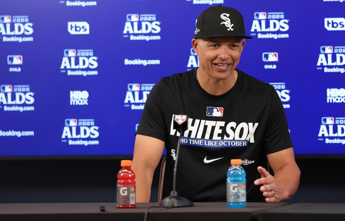 Chicago White Sox manager Will Venable smiles while taking questions in a postgame news conference after a win over the Cleveland Guardians in Game 1 of baseball's American League Division Series, Saturday, Oct. 3, 2026, in Cleveland. (AP Photo/Tim Phillis)