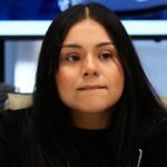 Marimar Martinez, a Chicago woman who was shot by a Border Patrol agent last year, listens to attorney Christopher Parente at a press conference Monday, Oct. 5, 2026, in Chicago. (AP Photo/Nam Y. Huh)