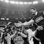 FILE - In this Jan. 26, 1986 file photo shows, Chicago Bears coach Mike Ditka reaches out to shake hands with New England Patriots coach Raymond Berry after the Bears won the NFL football Super Bowl XX game in New Orleans. (AP Photo/File)