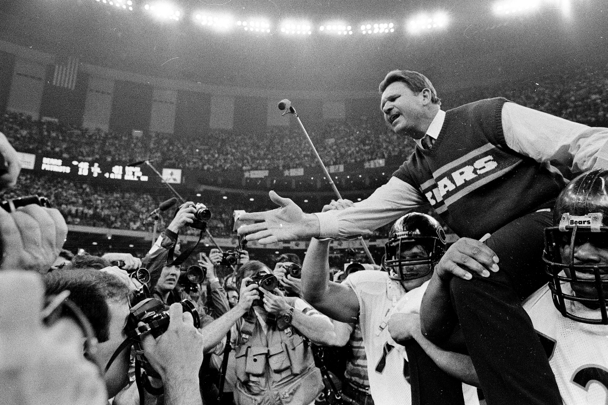 FILE - In this Jan. 26, 1986 file photo shows, Chicago Bears coach Mike Ditka reaches out to shake hands with New England Patriots coach Raymond Berry after the Bears won the NFL football Super Bowl XX game in New Orleans. (AP Photo/File)