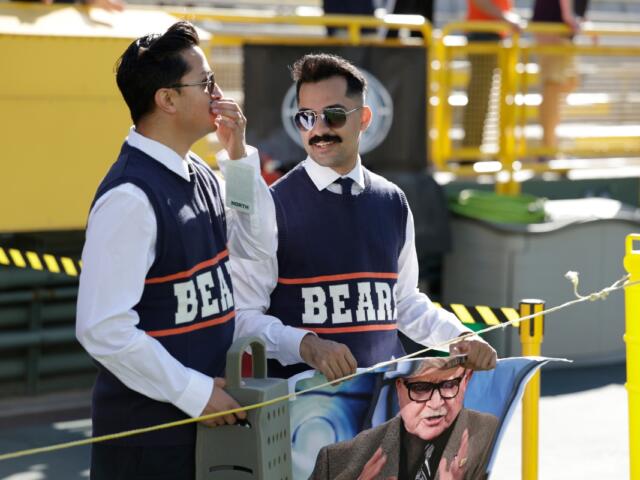 Chicago Bears fans dress up as Mike Ditka before an NFL football game against the Green Bay Packers in Green Bay, Wis., Sunday, Oct. 11, 2026. (AP Photo/Matt Ludtke)