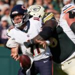 Chicago Bears' Case Keenum fumbles as he is hit by Green Bay Packers' Devonte Wyatt during the second half of an NFL football game in Green Bay, Wis., Sunday, Oct. 11, 2026. (AP Photo/Nam Huh)
