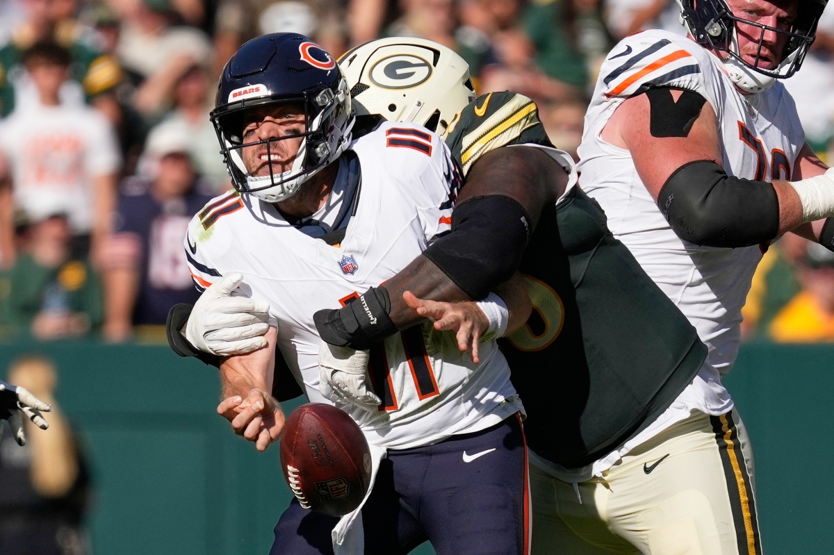 Chicago Bears' Case Keenum fumbles as he is hit by Green Bay Packers' Devonte Wyatt during the second half of an NFL football game in Green Bay, Wis., Sunday, Oct. 11, 2026. (AP Photo/Nam Huh)
