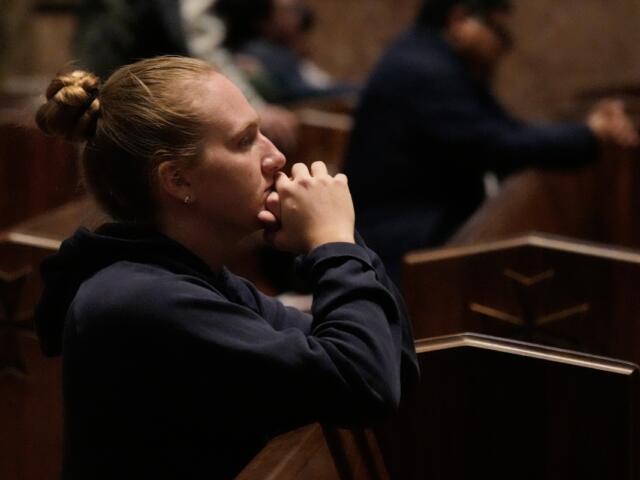 A person prays at a votive mass for Pope Leo XIV in light of his lung cancer diagnosis at Holy Name Cathedral in Chicago, Wednesday, Oct. 14, 2026. (AP Photo/Nam Y. Huh)