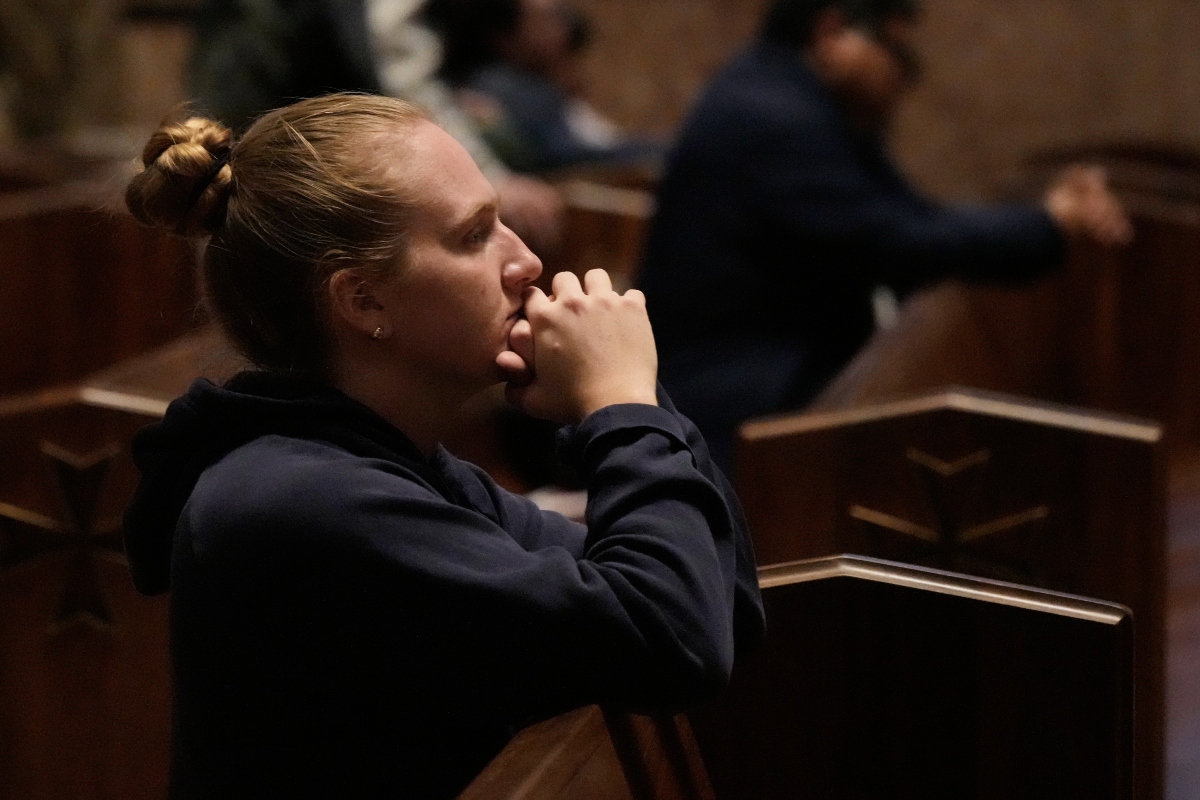 A person prays at a votive mass for Pope Leo XIV in light of his lung cancer diagnosis at Holy Name Cathedral in Chicago, Wednesday, Oct. 14, 2026. (AP Photo/Nam Y. Huh)