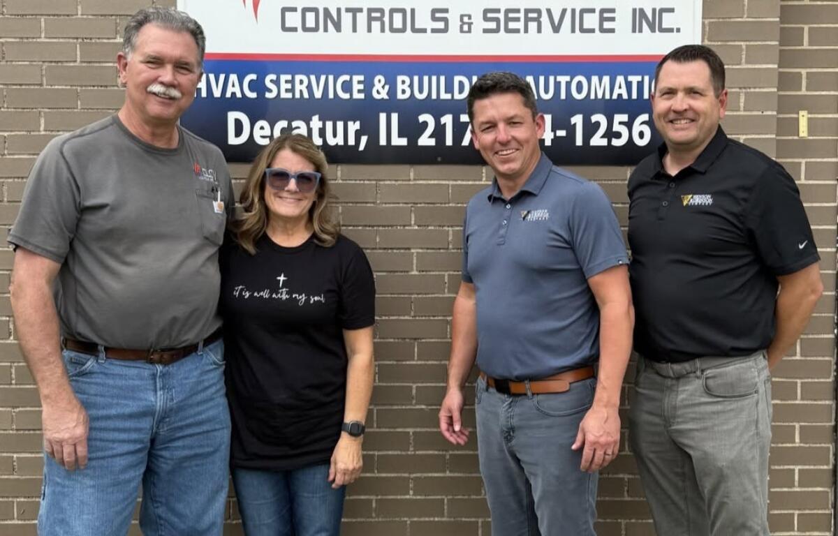 Dan and Annette Clow of Clow Controls with Joe Kulek and Brian Vogt of Henson Robinson marking the addition of Clow Controls to the Henson Robinson family.