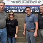 Dan and Annette Clow of Clow Controls with Joe Kulek and Brian Vogt of Henson Robinson marking the addition of Clow Controls to the Henson Robinson family.