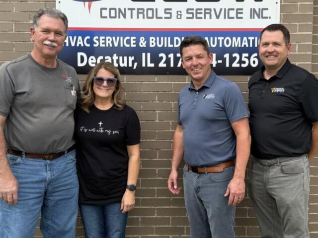 Dan and Annette Clow of Clow Controls with Joe Kulek and Brian Vogt of Henson Robinson marking the addition of Clow Controls to the Henson Robinson family.