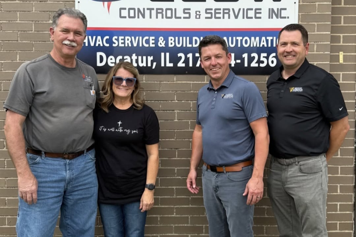 Dan and Annette Clow of Clow Controls with Joe Kulek and Brian Vogt of Henson Robinson marking the addition of Clow Controls to the Henson Robinson family.
