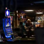 Slot machines light up the front window of a bar in Golconda, Illinois. (Credit: Julia Rendleman for Capitol News Illinois)