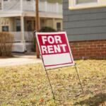 For sale for rent sign in front of home showing economic signs of increased inflation and mortgage rates depicting housing market crisis and financial troubles