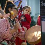 Sacramento, CA, U.S.A. - FEB. 13, 2024: A woman drums and sings during a song at the Missing and Murdered Indigenous Peoples Day of Action at the state capitol.